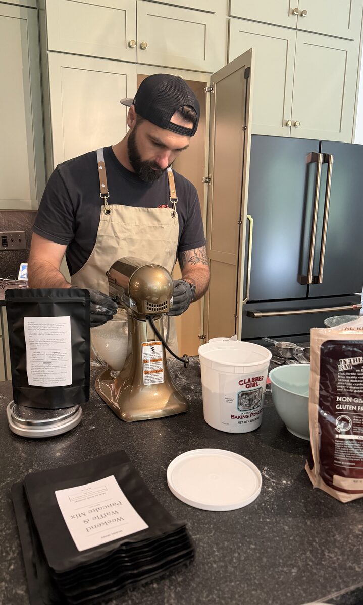 Blake at the stand mixer, weighing and bagging the first official batches of McNeil Mixes